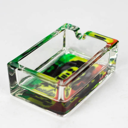Rectangle glass printed ashtray with green, yellow, and rainbow-toned abstract print