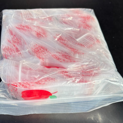 Clear ziplock bags with red apple logo, stacked and sealed at the top