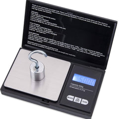 Digital pocket scale with stainless platform, blue LCD readout, and TARE/MODE buttons on black case.