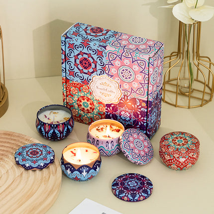 Soy candle gift set in colorful tins with lids, four candles shown