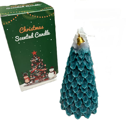 Blue-green Christmas tree scented candle next to green gift box