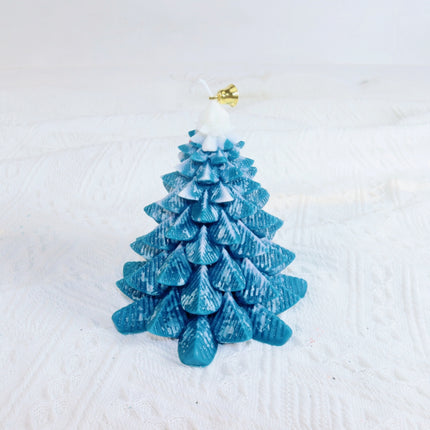 Blue-green Christmas tree-shaped candle, full view, white topper and gold ornament