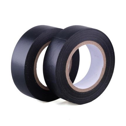 Black electrical tape rolls, two spools with exposed inner cores