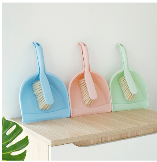 Colorful dustpan and brush set with blue, pink, and green plastic tools