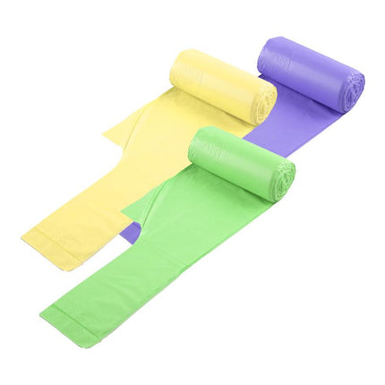 Kitchen bin liners, yellow, green, and purple rolls laid out