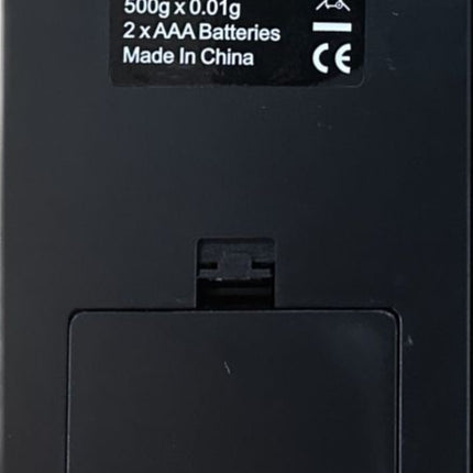 Digital pocket scale back panel with battery door and AA battery info label.