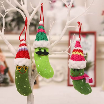 Set of three hanging plush pickle ornaments with Santa hats and red loops
