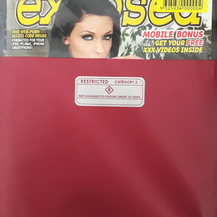 Two magazine covers in red packaging with barcode and a restricted label in the center
