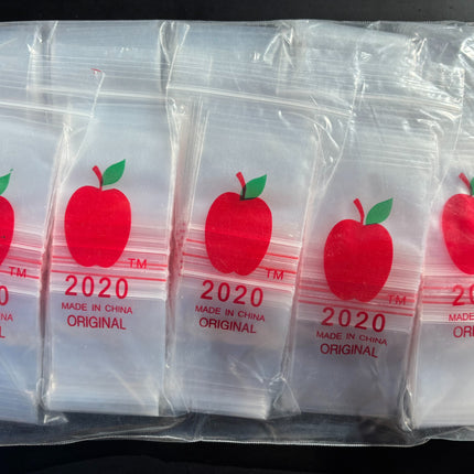 Set of clear ziplock bags with red apple graphics and '2020' branding, multiple pieces