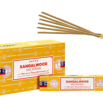 Satya sandalwood incense sticks, orange rectangular box with loose bundles of sticks