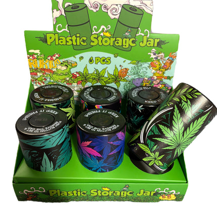 Set of 6 plastic storage jars on green leaf-pattern display tray, black lids