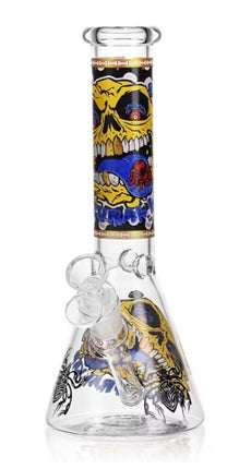 Glass water beaker with yellow skull monster graphic and gold rim, clear bubbler.