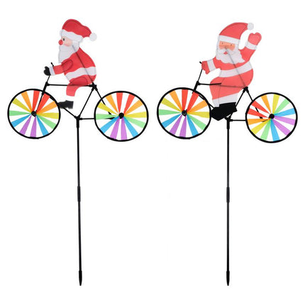 Christmas windmill spinner yard stake pair with Santa on rainbow bicycle, side view