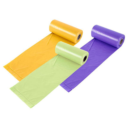 Assorted kitchen waste bag rolls in yellow, green, and purple, laid out flat
