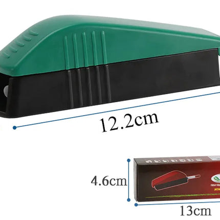 Green cigarette rolling tube machine with black guide channel