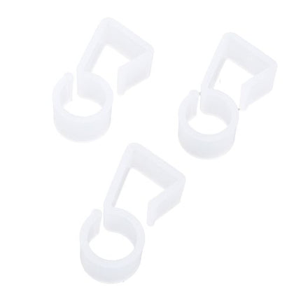 Three white plastic gutter hooks for hanging Christmas light cords