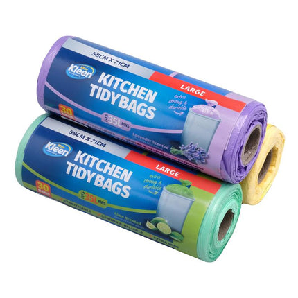 Stacked large kitchen tidy bag rolls in lavender, blue, and green colors