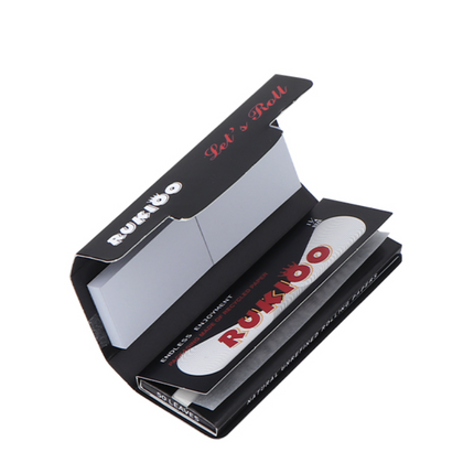 Rolling paper and tips set, open black box with papers, tips tray, and Rukioo label