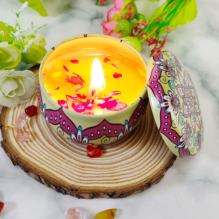Lit votive soy candle in colorful patterned tin with citronella wax