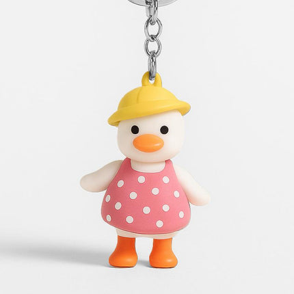 Yellow-hat duck girl keychain charm with pink polka-dot dress and silver chain