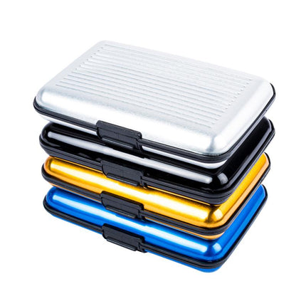 Stacked hard-case card wallets with metallic shells in white, black, gold, and blue