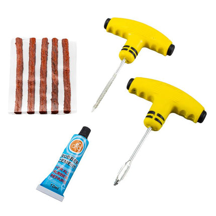 Tyre puncture repair kit set: yellow tools, rubber cement tube, and rubber plugs