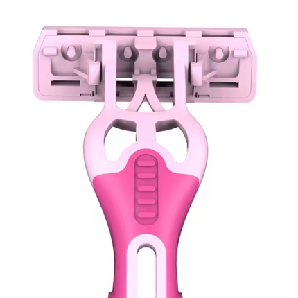Close-up of pink razor head and triple blade cartridge on handle