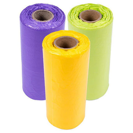 Three loose kitchen bin liner rolls: purple, lime green, and yellow
