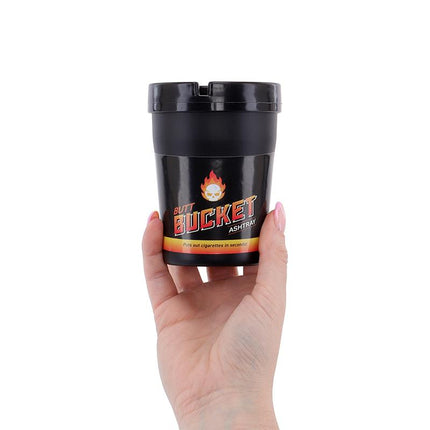 Black butt bucket ashtray with removable lid, held in hand