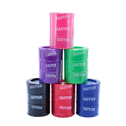 Assorted slime-filled barrels in pink, purple, green, blue, red, and navy with CAUTION labels