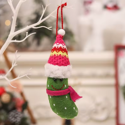 Single hanging plush pickle ornament with red Santa hat, green face and scarf