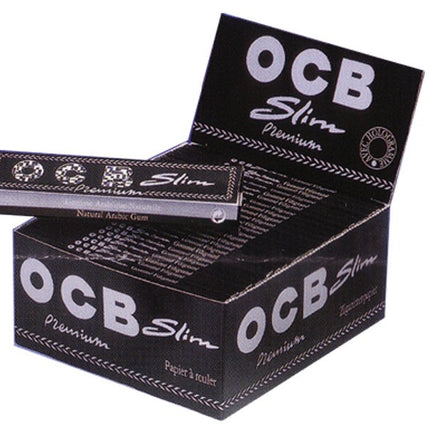 OCB Premium slim rolling papers without tips, open box with paper sheets visible.