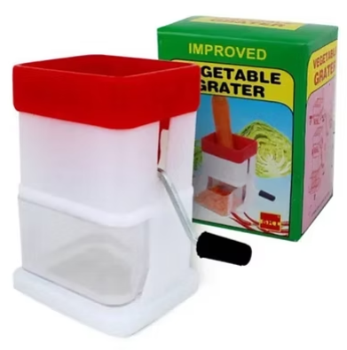 Vegetable grater with red hopper, white body, black handle, shown beside retail box