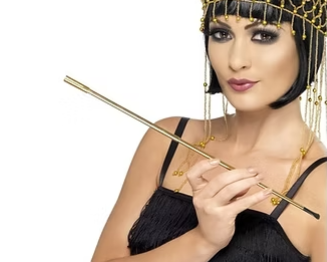 Telescopic cigarette holder with gold tube, held by gloved hands
