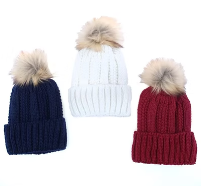 Three thermal-lined ribbed knit beanies—navy, white, and maroon—with faux-fur pom-poms
