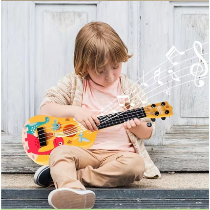 Child playing a yellow animal-pattern toy guitar with black fretboard and six strings