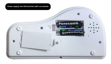 Electronic keyboard back with battery compartment cover and speaker grille