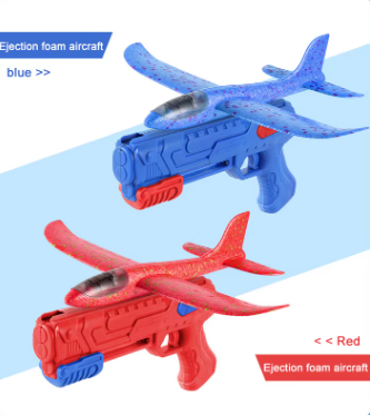 Toy glider launcher set showing blue and red foam blaster with glider aircraft