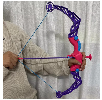 Archery toy bow close-up with purple-blue frame, blue string, red arrow