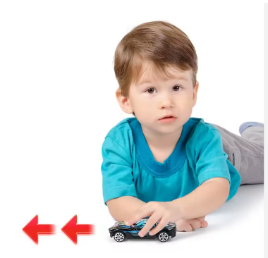 Toddler holding a small die-cast racing car toy