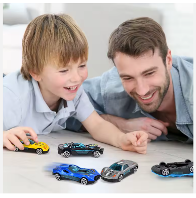 Child and adult playing with 1:64 die-cast racing cars on a tabletop
