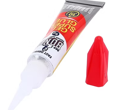 Gel super glue tube with red cap and dispensing tip