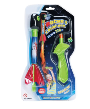 Toy rocket launcher with light in blister pack, green launcher and red rocket
