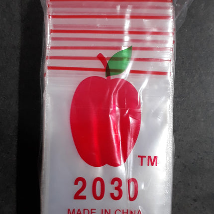 Red apple print zip-top bag, 75 x 50 mm, clear plastic with red stripes